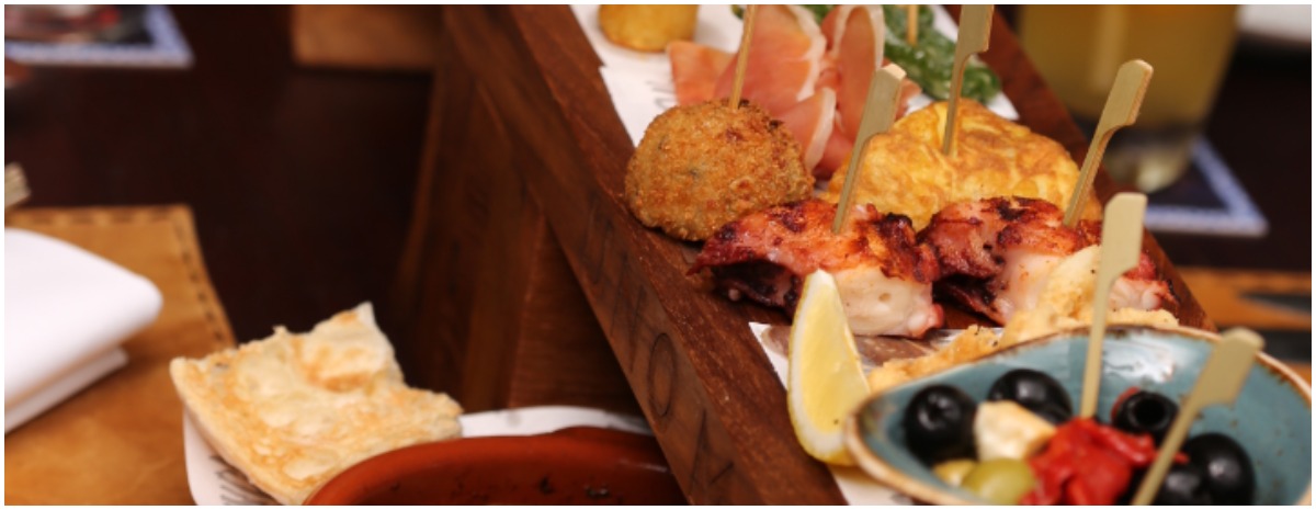 Stuff yourself with this two-foot tapas platter at Uno Mas