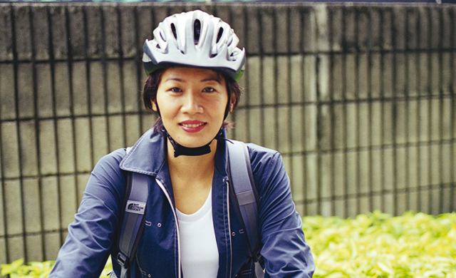 Jutaporn Sakdamnan rides her bike to work